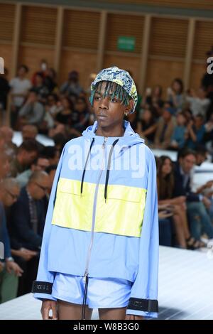 A model displays a new creation at the fashion show of Kenzo during the Paris Men's Fashion Week Spring/Summer 2017 in Paris, France, 25 June 2016. Stock Photo
