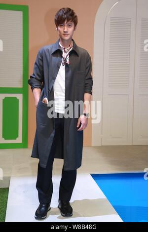 Chinese actor Jiang Jinfu poses at the Fendi fashion show during the 2017 Spring/Summer Milan Men's Fashion Week in Milan, Italy, 20 June 2016. Stock Photo