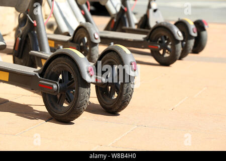 Electric scooters parked in sidewalk in downtown Athens, Greece Stock ...