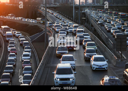 --FILE--Vehicles move slowly in a traffic jam on an elevated highway in Beijing, China, 23 February 2016.   Beijing has preliminarily worked out polic Stock Photo