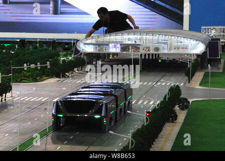 A model of an electric bus is on display during the 19th China Beijing International High-tech Expo (CHITEC) in Beijing, China, 19 May 2016.   The 19t Stock Photo