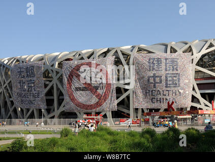 View of anti-smoking banners displayed on the Beijing National Stadium, also known as the Bird's Nest, ahead of World No Tobacco Day in Beijing, China Stock Photo