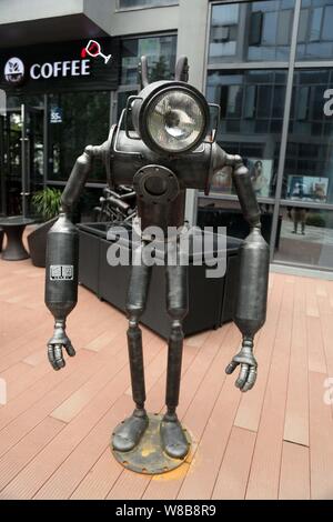 A robot-shaped sculpture is on display at the robot-themed cafe Airobot Coffee in Shanghai, China, 31 May 2016.   Artificial intelligence is making it Stock Photo