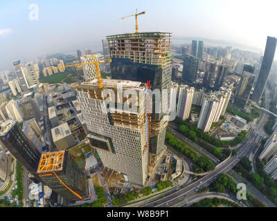 The Tencent Haibin Building, the new global headquarters of Tencent, is under construction in Shenzhen city, south China's Guangdong province, 27 Octo Stock Photo