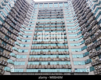 View of air conditioning units on the walls of a 25-story building in Fuzhou city, southeast China's Fujian province, 25 May 2016.   Nearly 600 air co Stock Photo