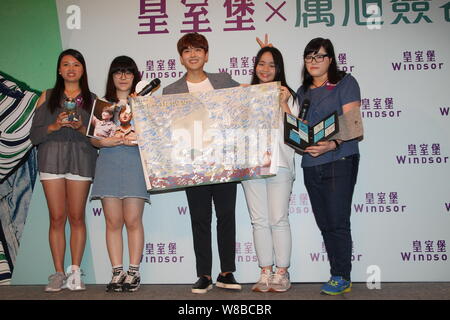 Singer and actor Kim Ryeo-wook, center, better known by the mononym Ryeowook, of South Korean boy group Super Junior attends a fan meeting and autogra Stock Photo