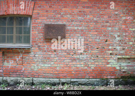 Finnish civil war era execution site wall with bullet holes and a plaque in Lahti, Finland. Stock Photo
