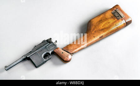 Antique German broomhandle pistol made around 1926 with attached wooden shoulder stock. Stock Photo