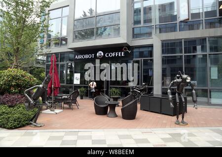 Robot-shaped sculptures are on display at the robot-themed cafe Airobot Coffee in Shanghai, China, 31 May 2016.   Artificial intelligence is making it Stock Photo