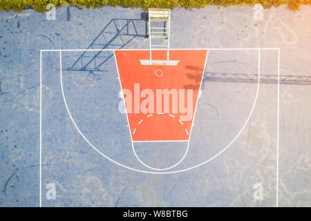 Aerial view, Top View, Bird eye view of school college with Basketball courts. basketball field in morning right. Stock Photo