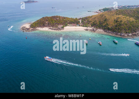 Aerial top view of ocean waves, beach and rocky coastline and beautiful forest. Beautiful nature background. island background and tropical with touri Stock Photo