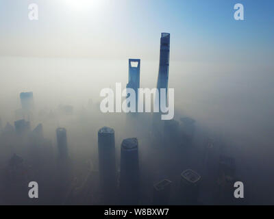 The Shanghai World Financial Center, second tallest, the Shanghai Tower, tallest, and other high-rise buildings and skyscrapers are seen vaguely in he Stock Photo