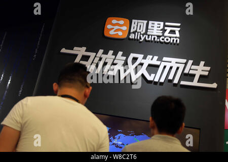 --FILE--People visit the stand of Aliyun.com, the online cloud computing unit of Alibaba Group, during the 13th China Digital Entertainment Expo, also Stock Photo