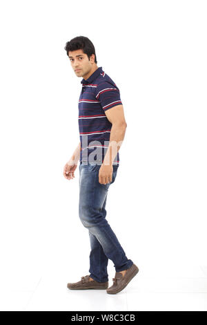 Portrait of a young man walking Stock Photo