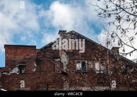 Backside old weathered vintage brick building wall facade Stock Photo