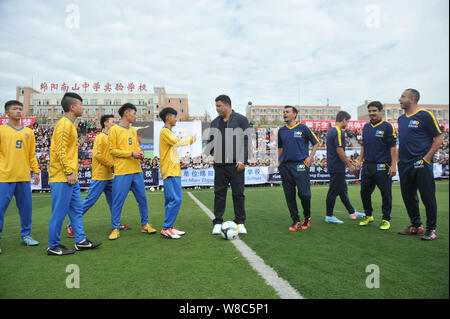 Brazilian football star Ronaldo Luiz Nazario de Lima, center, attends a football event in a high school in Mianyang city, southwest China's Sichuan pr Stock Photo