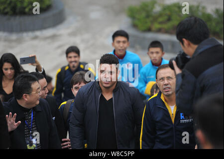 Brazilian football star Ronaldo Luiz Nazario de Lima, center, attends a football event in a high school in Mianyang city, southwest China's Sichuan pr Stock Photo