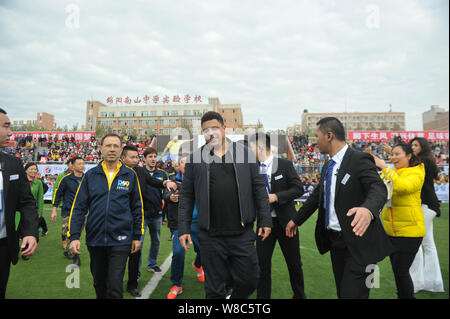 Brazilian football star Ronaldo Luiz Nazario de Lima, center, attends a football event in a high school in Mianyang city, southwest China's Sichuan pr Stock Photo