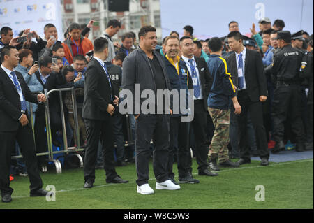 Brazilian football star Ronaldo Luiz Nazario de Lima, center, attends a football event in a high school in Mianyang city, southwest China's Sichuan pr Stock Photo