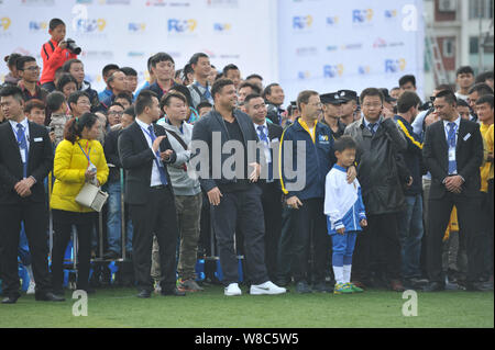 Brazilian football star Ronaldo Luiz Nazario de Lima, left, speaks during a football event in a high school in Mianyang city, southwest China's Sichua Stock Photo