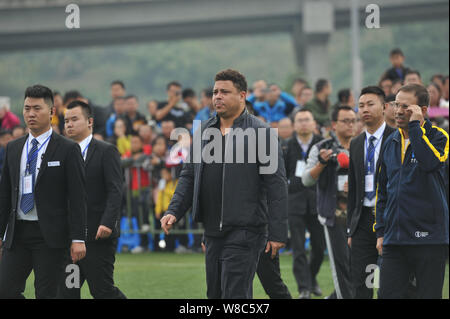 Brazilian football star Ronaldo Luiz Nazario de Lima, center, attends a football event in a high school in Mianyang city, southwest China's Sichuan pr Stock Photo