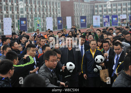 Brazilian football star Ronaldo Luiz Nazario de Lima, center, attends a football event in a high school in Mianyang city, southwest China's Sichuan pr Stock Photo