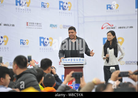 Brazilian football star Ronaldo Luiz Nazario de Lima, left, speaks during a football event in a high school in Mianyang city, southwest China's Sichua Stock Photo