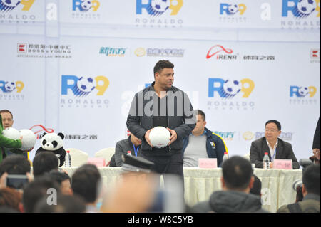 Brazilian football star Ronaldo Luiz Nazario de Lima, center, attends a football event in a high school in Mianyang city, southwest China's Sichuan pr Stock Photo