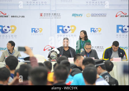 Brazilian football star Ronaldo Luiz Nazario de Lima, center, attends a football event in a high school in Mianyang city, southwest China's Sichuan pr Stock Photo