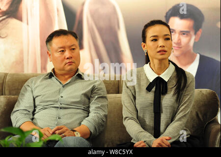 Taiwanese actress Shu Qi, right, and Chinese director Tang Huatao attend a promotional event for their movie 'The Last Women Standing' in Hangzhou cit Stock Photo