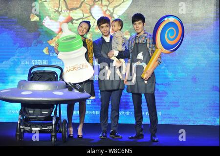 (From left) Chinese actress Zhang Ziyi as a producer, actors Zhang Yixing and Chen Xuedong pose with a little baby at a press conference for their new Stock Photo