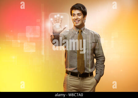 Businessman using a touch screen for biometrics identification Stock Photo