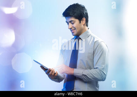 Businessman using a digital tablet Stock Photo