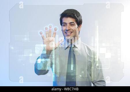 Businessman using a touch screen for biometrics identification Stock ...