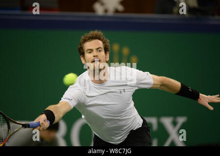 Andy Murray of Britain returns a shot to Tomas Berdych of Czech Republic in their quarter-final match of the men's singles during the 2015 Shanghai Ro Stock Photo