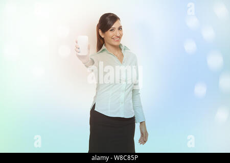Businesswoman showing a smart phone Stock Photo
