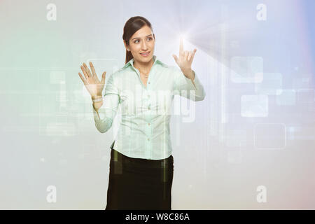 Businesswoman using futuristic touch screen Stock Photo