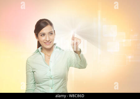 Businesswoman using futuristic touch screen Stock Photo
