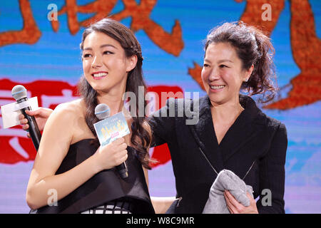 Malaysian actress Michelle Yeoh, right, and Australian actress Natasha Liu Bordizzo react at a press conference for their new movie 'Crouching Tiger, Stock Photo