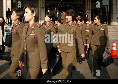 Members of North Korean pop group Moranbong Band leave a hotel for a rehearsal in Beijing, China, 11 December 2015.   Moranbong Band is the latest (an Stock Photo