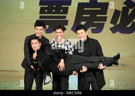 South Korean actor Shin Hyun-joon, front, is held by (from left) Chinese actors Yang Xuwen, Qiao Zhenyu and Ding Wenbo at a press conference for their Stock Photo