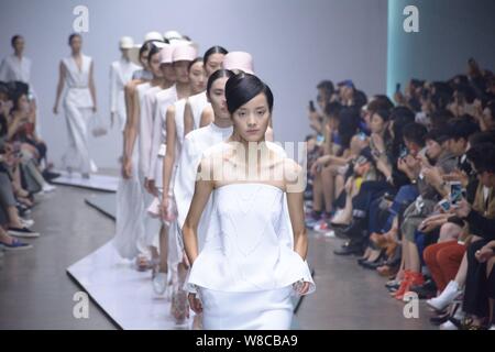 Chinese model Pei Bei, front, and other models display new creations at ...