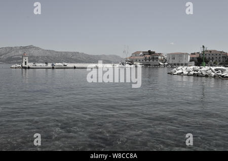 Port panorama of Small dalmatian town Postira, black and white photography Stock Photo