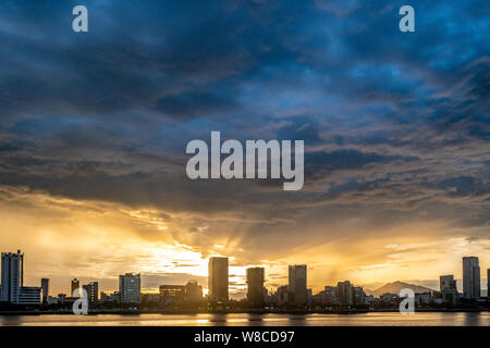 Beautiful sunset over  Đà Nẵng city in central Vietnam with heavy clouds above