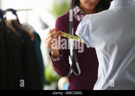 Female hands in the workshop hold Stock Photo