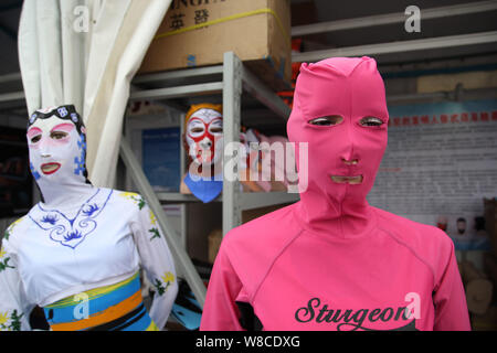 Facekini masks by Chinese facekini designer Zhang Shifan are on display at her stand during the 13th China International Marine Fair and China (Qingda Stock Photo