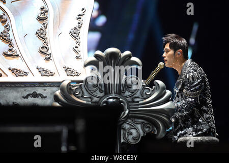 Taiwanese singer Jay Chou performs at the Tianjin concert during his 'Opus 2 Jay 2015 World Tour' in Tianjin, China, 25 April 2015. Stock Photo