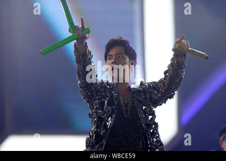 Taiwanese singer Jay Chou performs at the Tianjin concert during his 'Opus 2 Jay 2015 World Tour' in Tianjin, China, 25 April 2015. Stock Photo