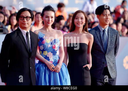 Chinese actress Wang Luodan, second right, Taiwanese actor Vic Chou, right, and Hong Kong director Xxide Pang Chun, left, pose on the red carpet for t Stock Photo