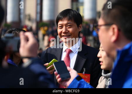 Lei Jun, Chairman and CEO of Xiaomi Technology, smiles as he leaves the Great Hall of the People after the opening meeting of the third Session of the Stock Photo